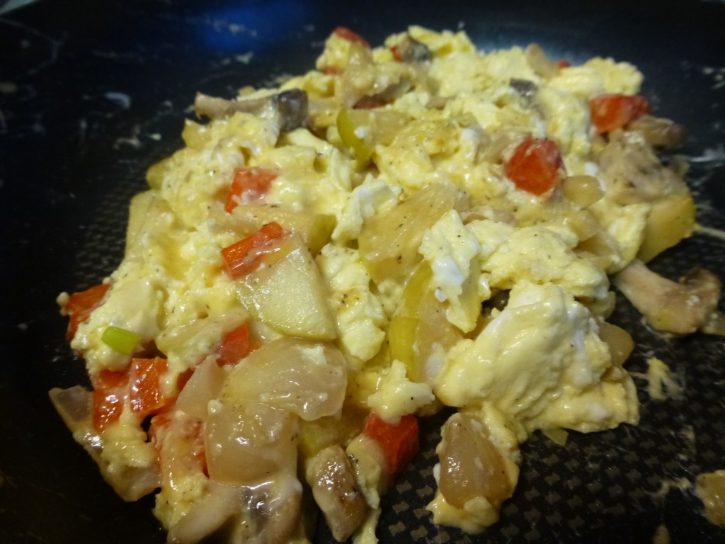 Fold veggies, apples, & cheese into the eggs.